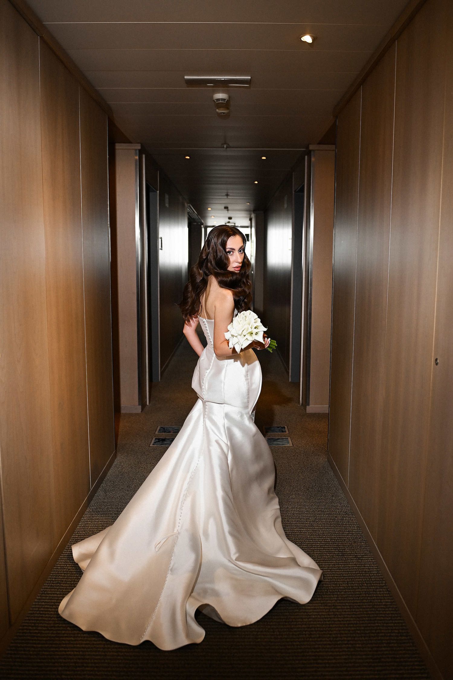 Dynamic bridal portrait showcasing dress movement and bold direct flash at the historic El Telar venue