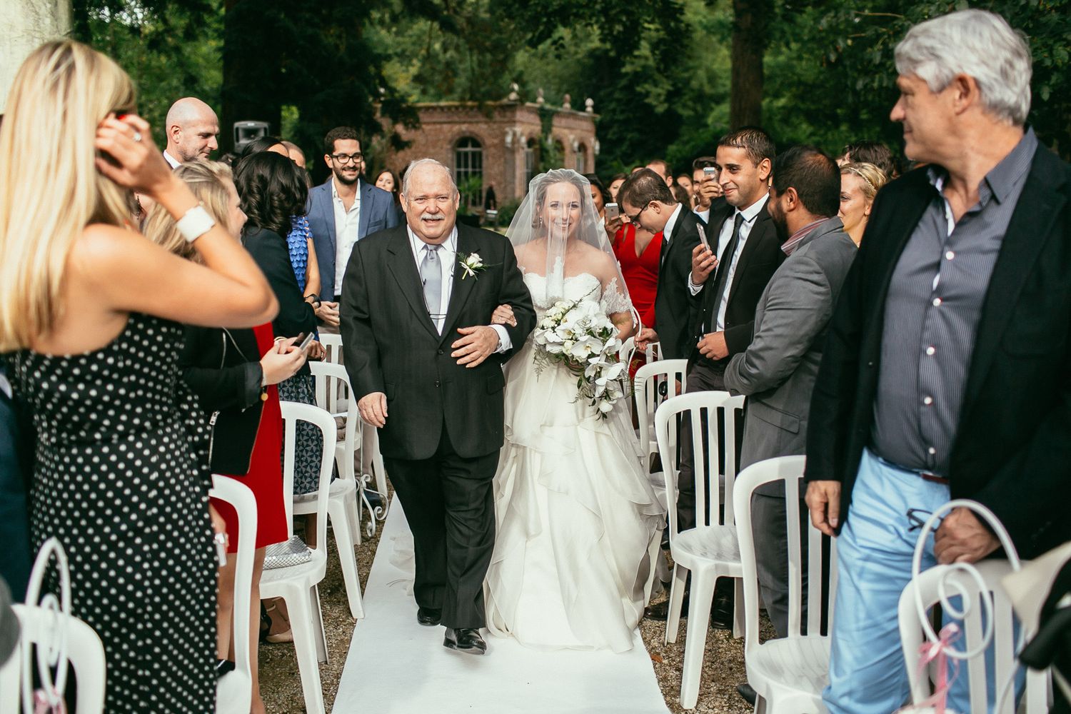 Romantic couple moments after the ceremony at Château de Changy. Elegant movement and genuine emotions.