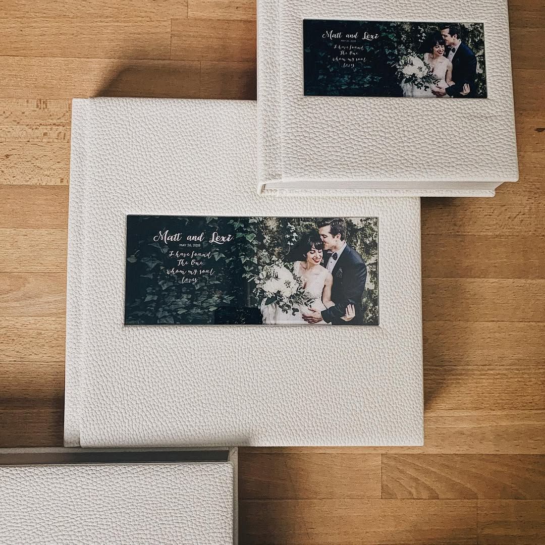 Three bespoke wedding albums in various sizes, custom-made for the couple, their friends, and relatives by Darista Wedding.