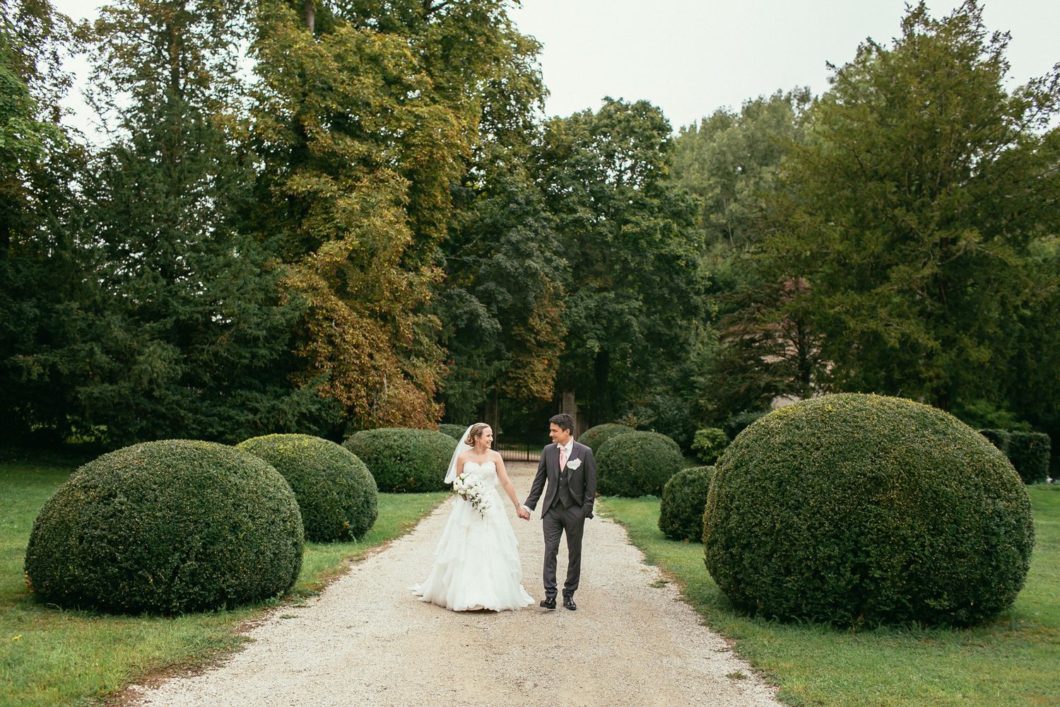 Garden details at Château de Changy. Luxury destination wedding photography featuring classic French landscape.