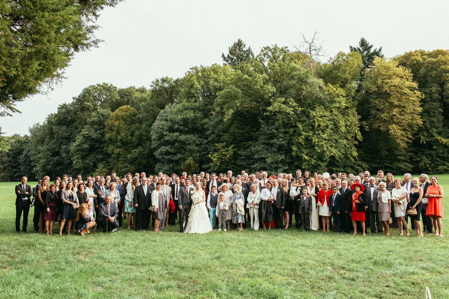 Unscripted emotions at a luxury wedding ceremony. Château de Changy architecture framing a heartfelt, sincere moment