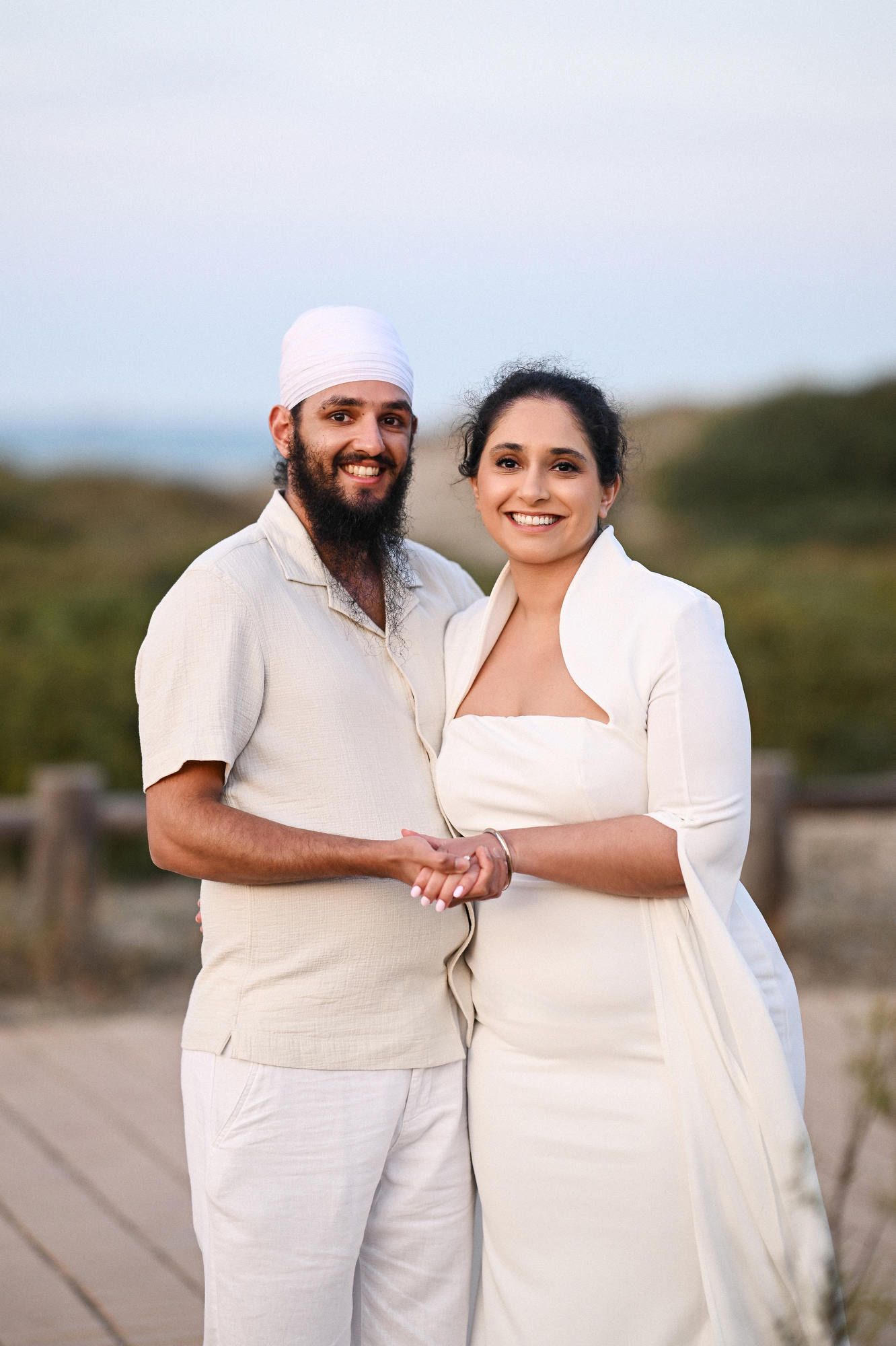 Happy couple smiling at the camera after their surprise marriage proposal - captured by a professional Valencia photo and video team