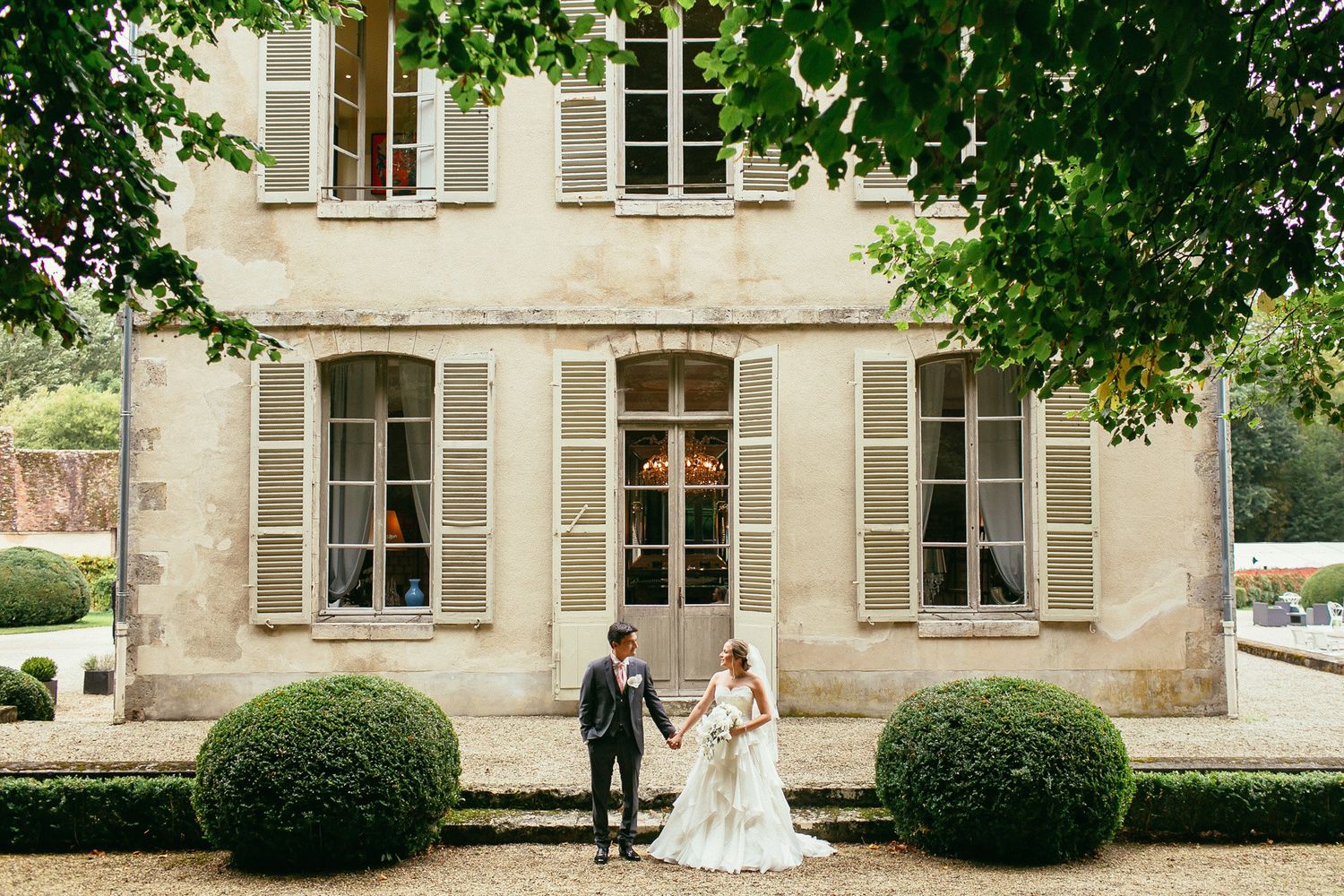 Garden details at Château de Changy. Luxury destination wedding photography featuring classic French landscape.