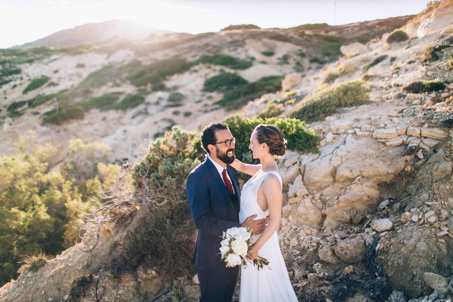 Landscape wedding photography showcasing the unique white rocky formations of Milos island