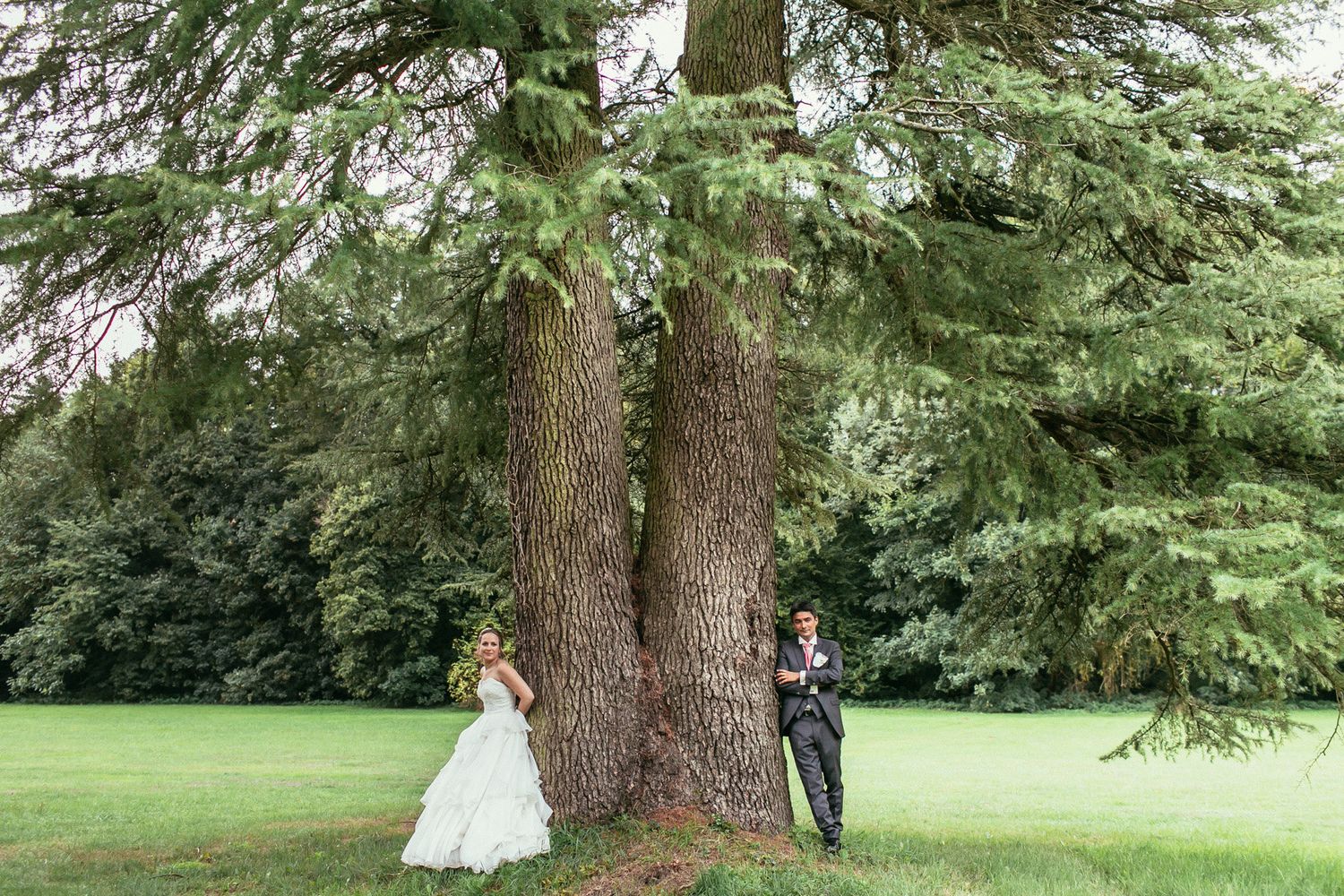 High-fashion bridal portrait in the formal gardens of Château de Changy. Sophisticated aesthetics and historic castle backdrops