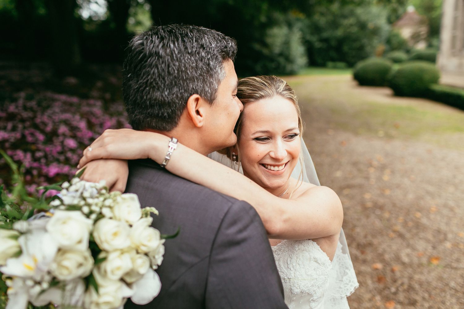 High-fashion bridal portrait in the formal gardens of Château de Changy. Sophisticated aesthetics and historic castle backdrops