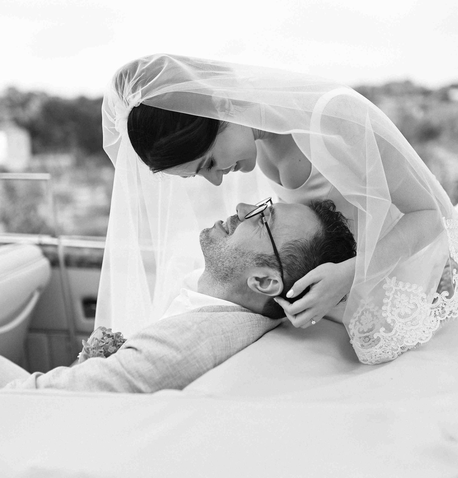 A cinematic black and white shot of a tender kiss, showcasing the romantic aesthetics of unique Valencian wedding documented by photographer