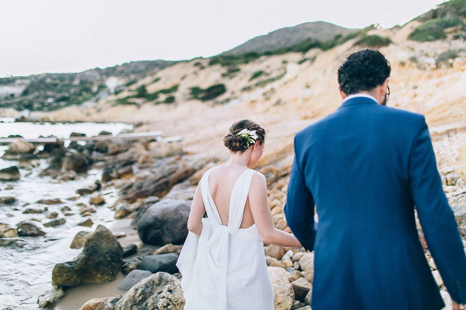 The newlyweds walking back from their private photo session to join the celebration