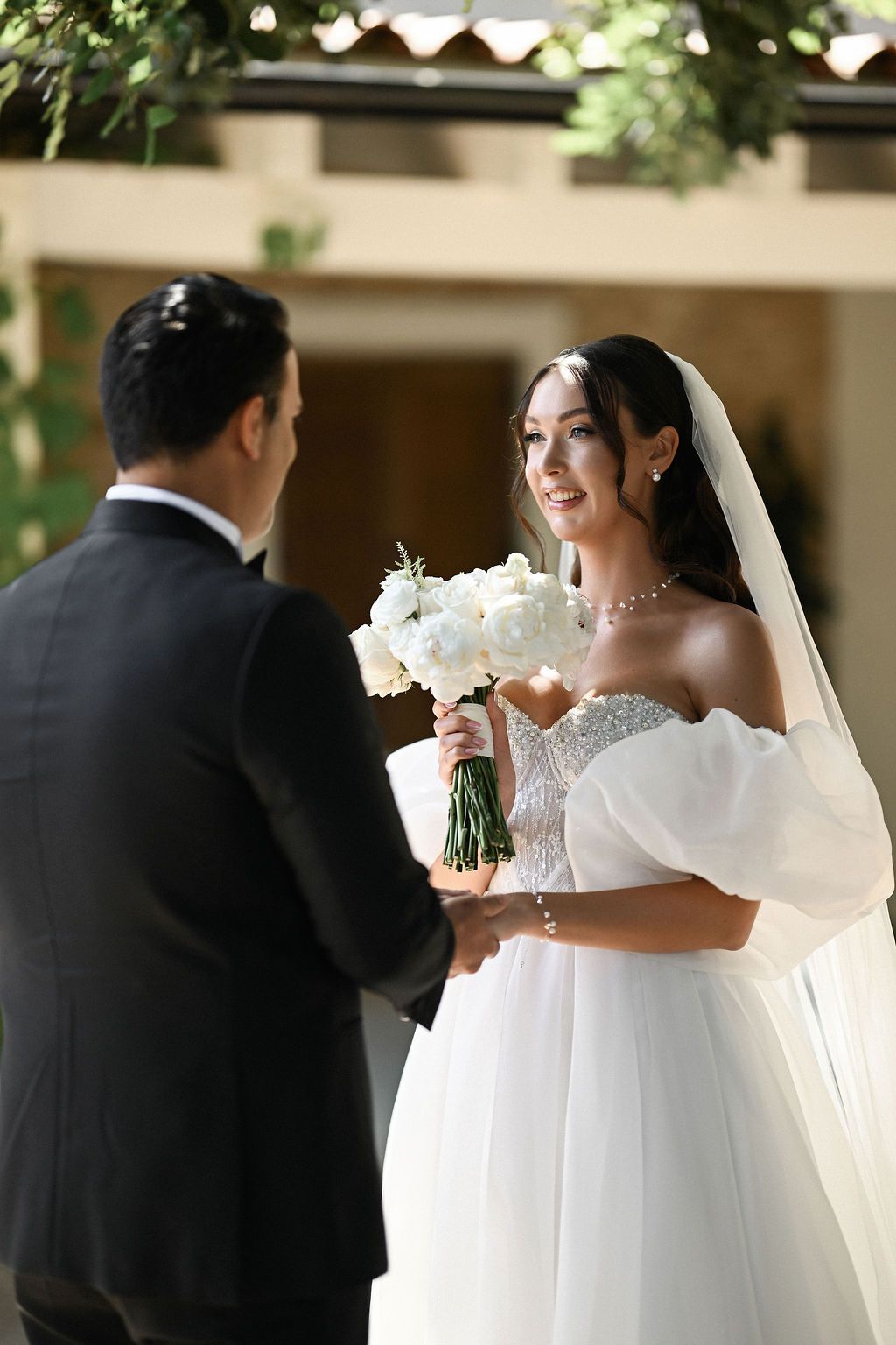 Close-up shot of the groom's raw emotion as he turns around and sees his beautiful bride for the first time at Finca del Canónigo.