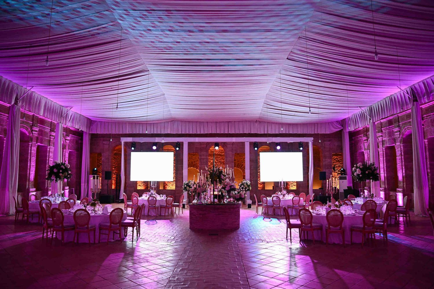Wide shot of the Great Refectory at Ara Christi with professional lighting, showcasing its royal scale and luxury decor.