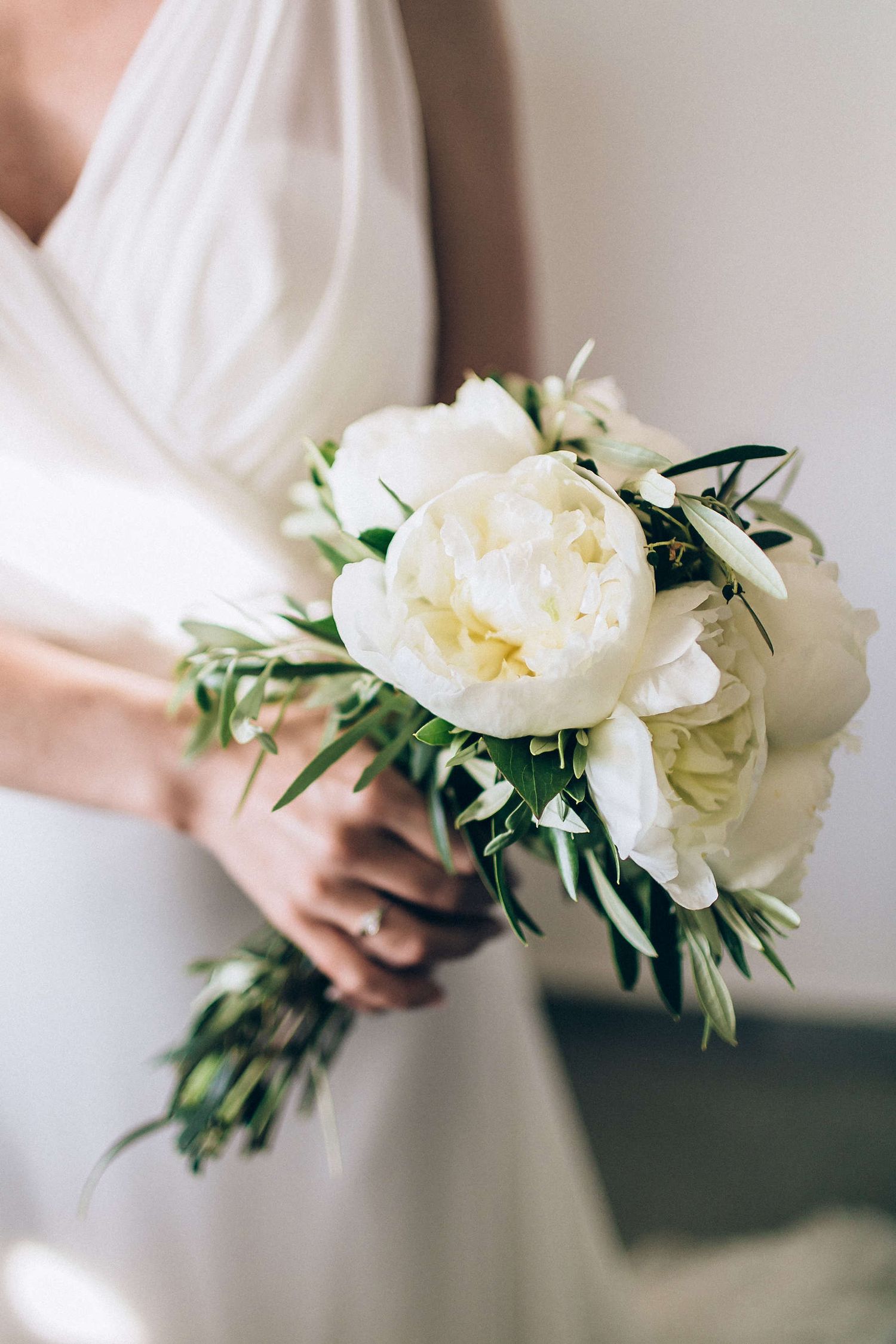 Close-up of a luxury wedding bouquet with white and pink peonies in Milos.