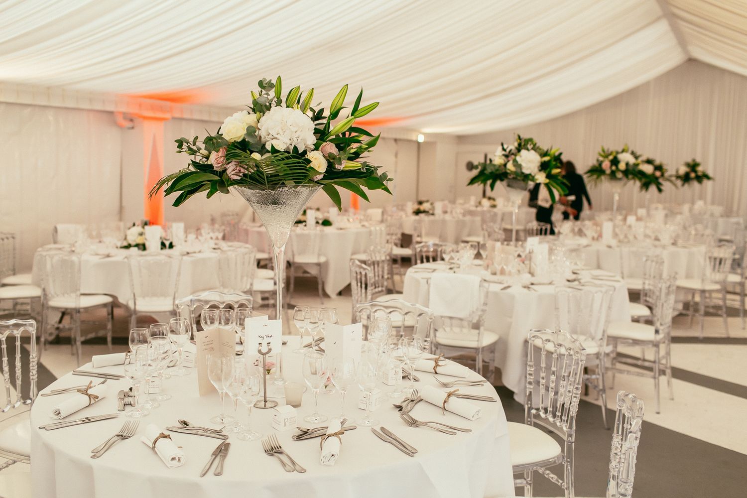 Evening wedding dinner at Château de Changy. Luxury banquet setup with cinematic lighting and warm atmosphere