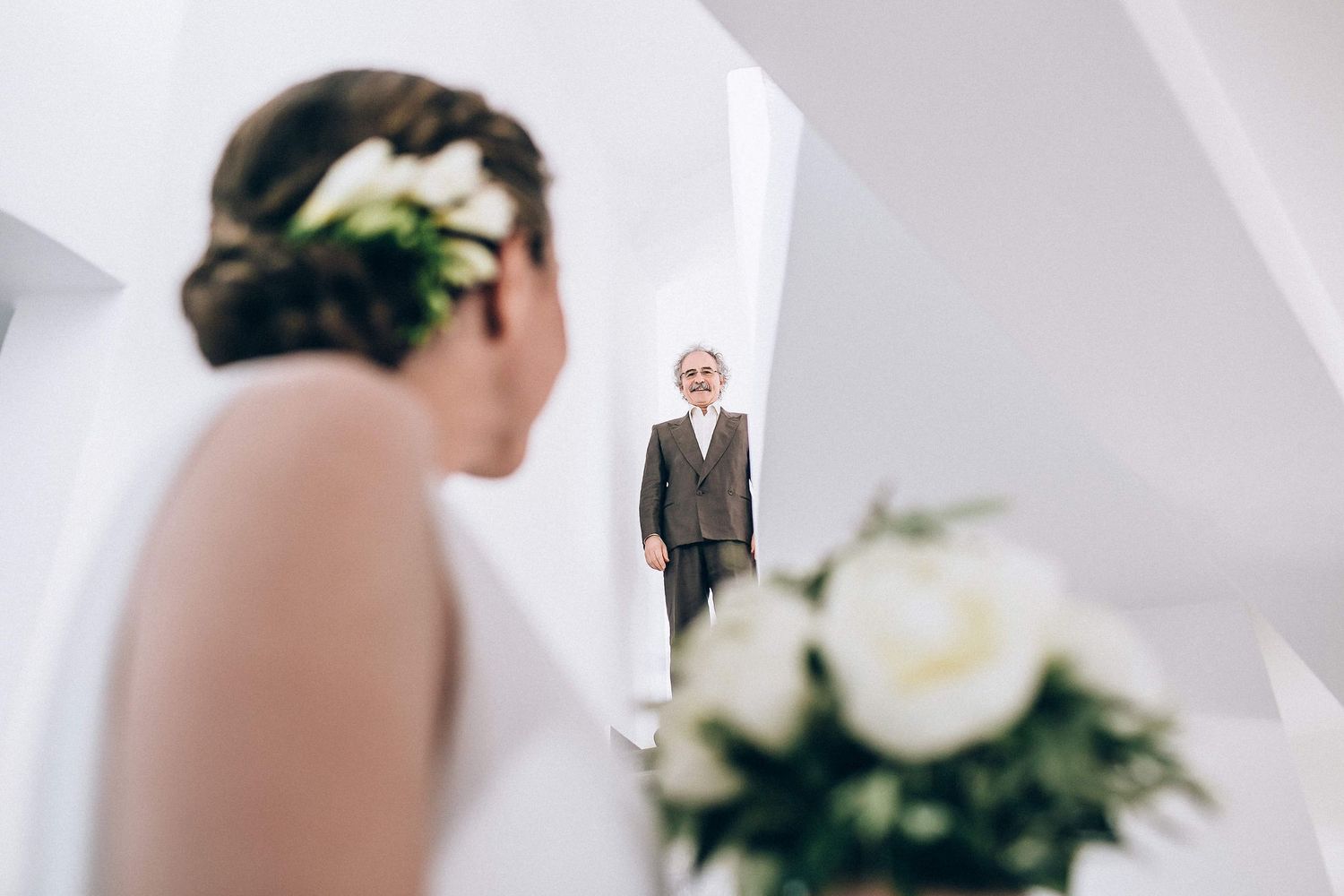 Candid and emotional moment of the bride look at her father at their family home in Milos