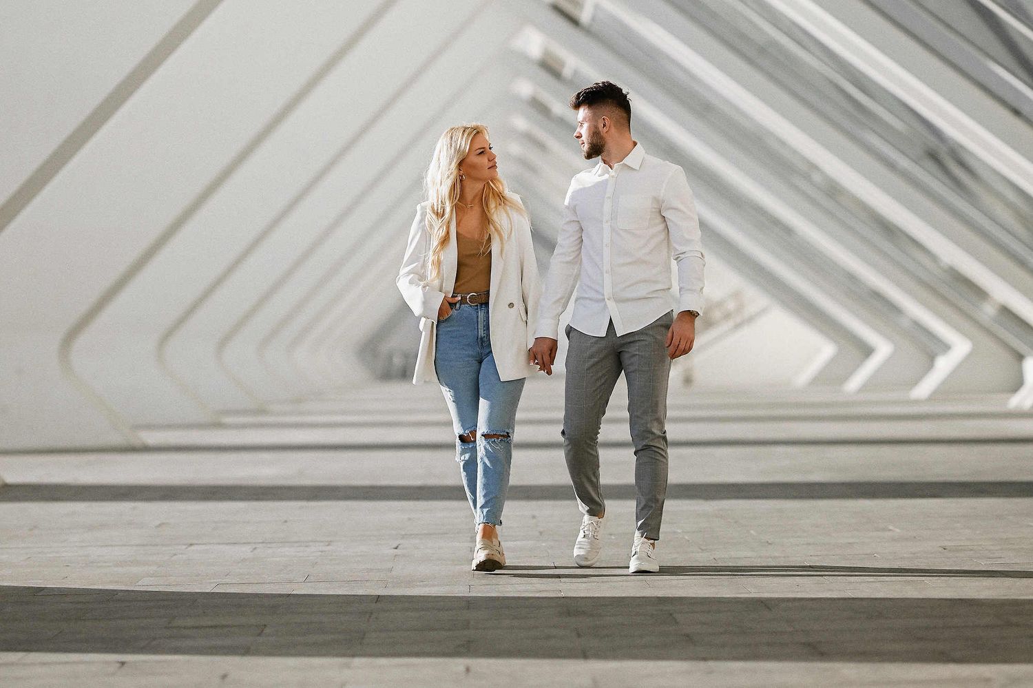 Couple walking through the Umbracle gardens during a romantic engagement session