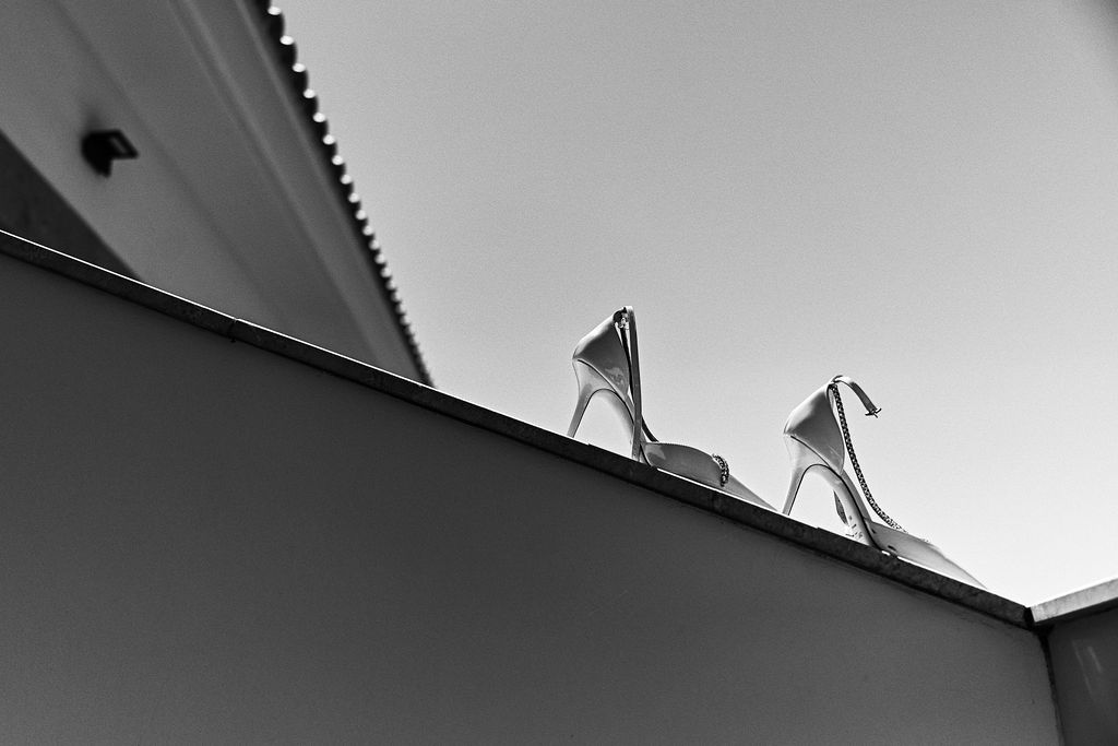 Artistic high-contrast portrait of Jimmy Choo bridal shoes. Editorial wedding details captured at Finca El Senyoret in Benidorm.