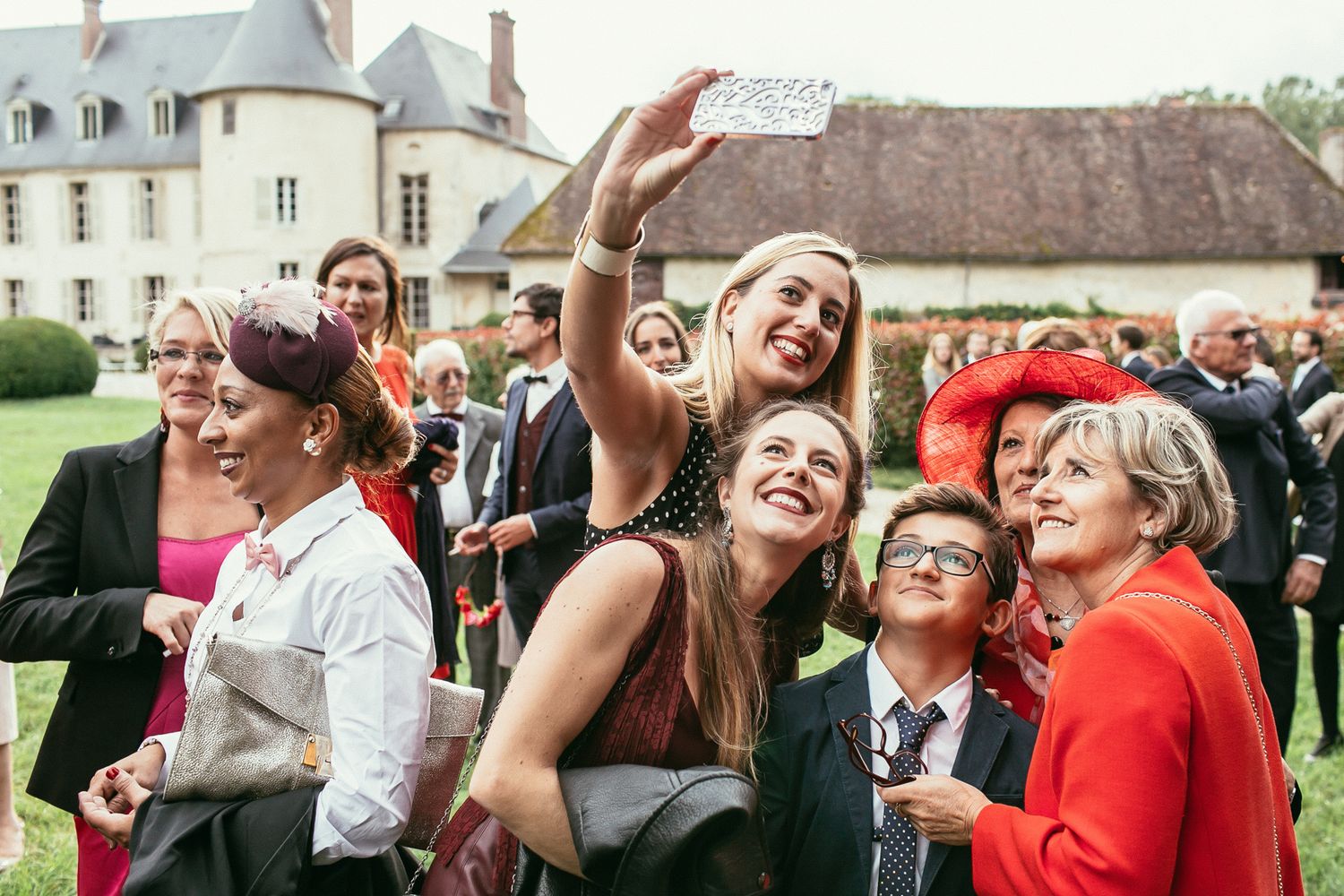 Unscripted emotions at a luxury wedding ceremony. Château de Changy architecture framing a heartfelt, sincere moment