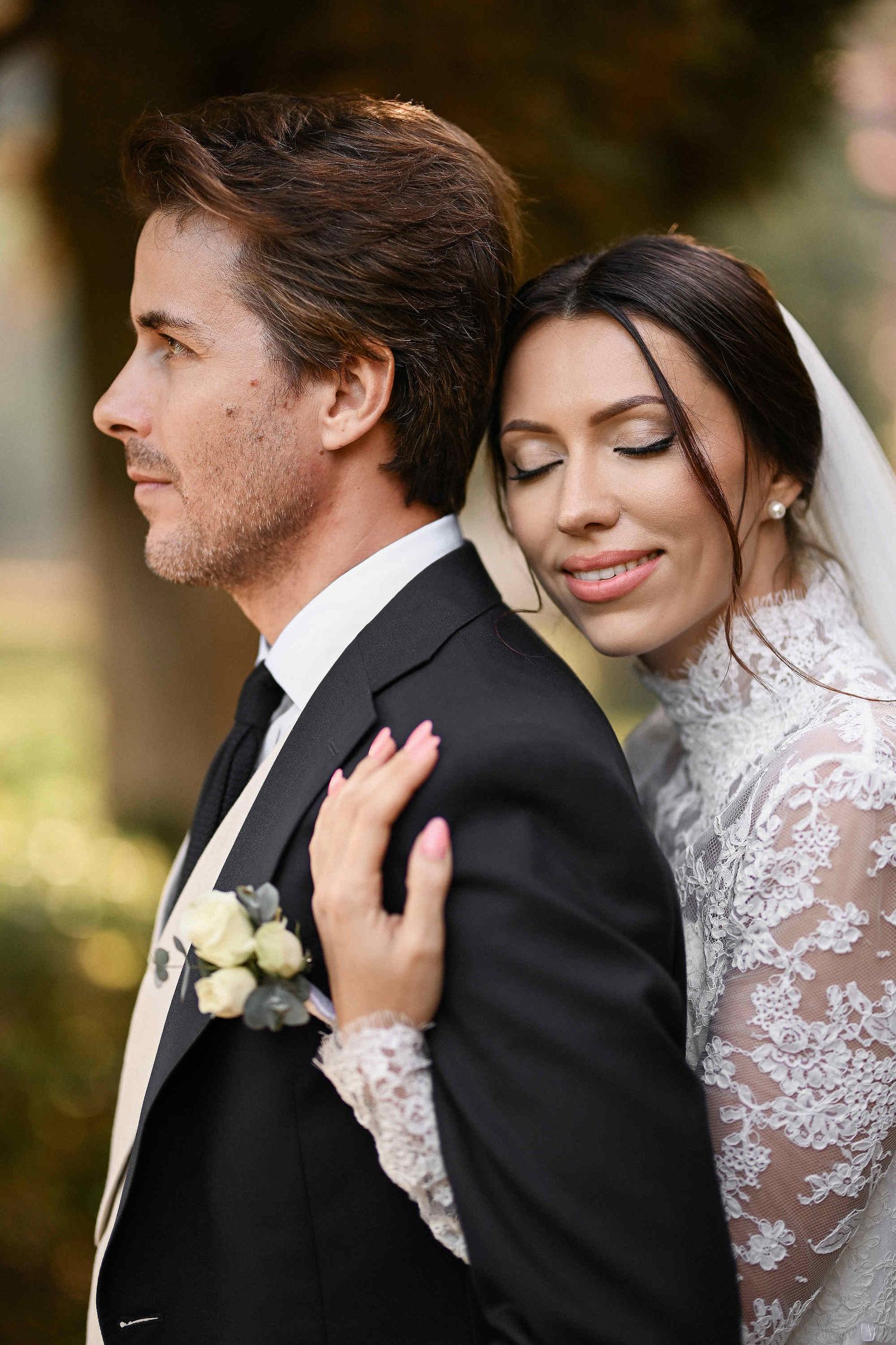 A soulful and heartfelt embrace as the groom holds his bride against the timeless backdrop of Valencia's