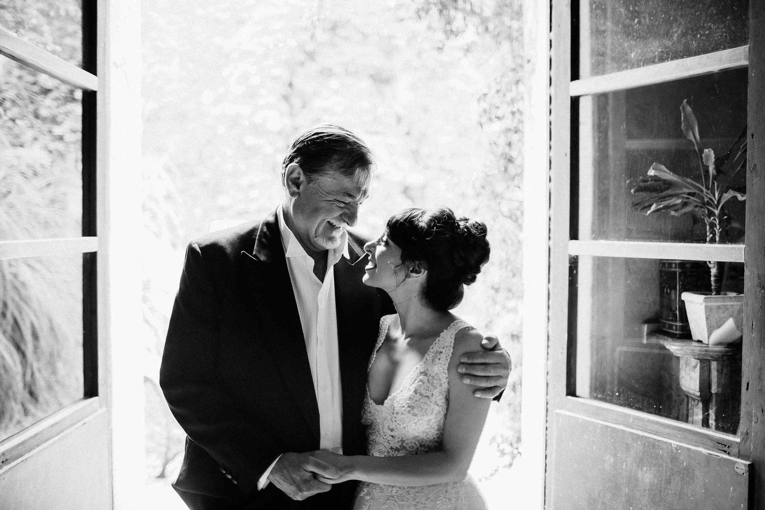 Emotional portrait of the bride and her father at a historic Catalan villa. A sincere moment preserved by destination wedding photographers.