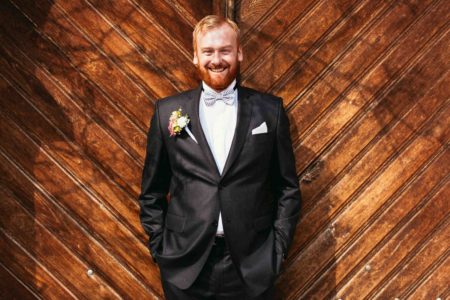 Irish groom with a red beard during an editorial wedding session - professional film photographer in Europe capturing authentic portraits