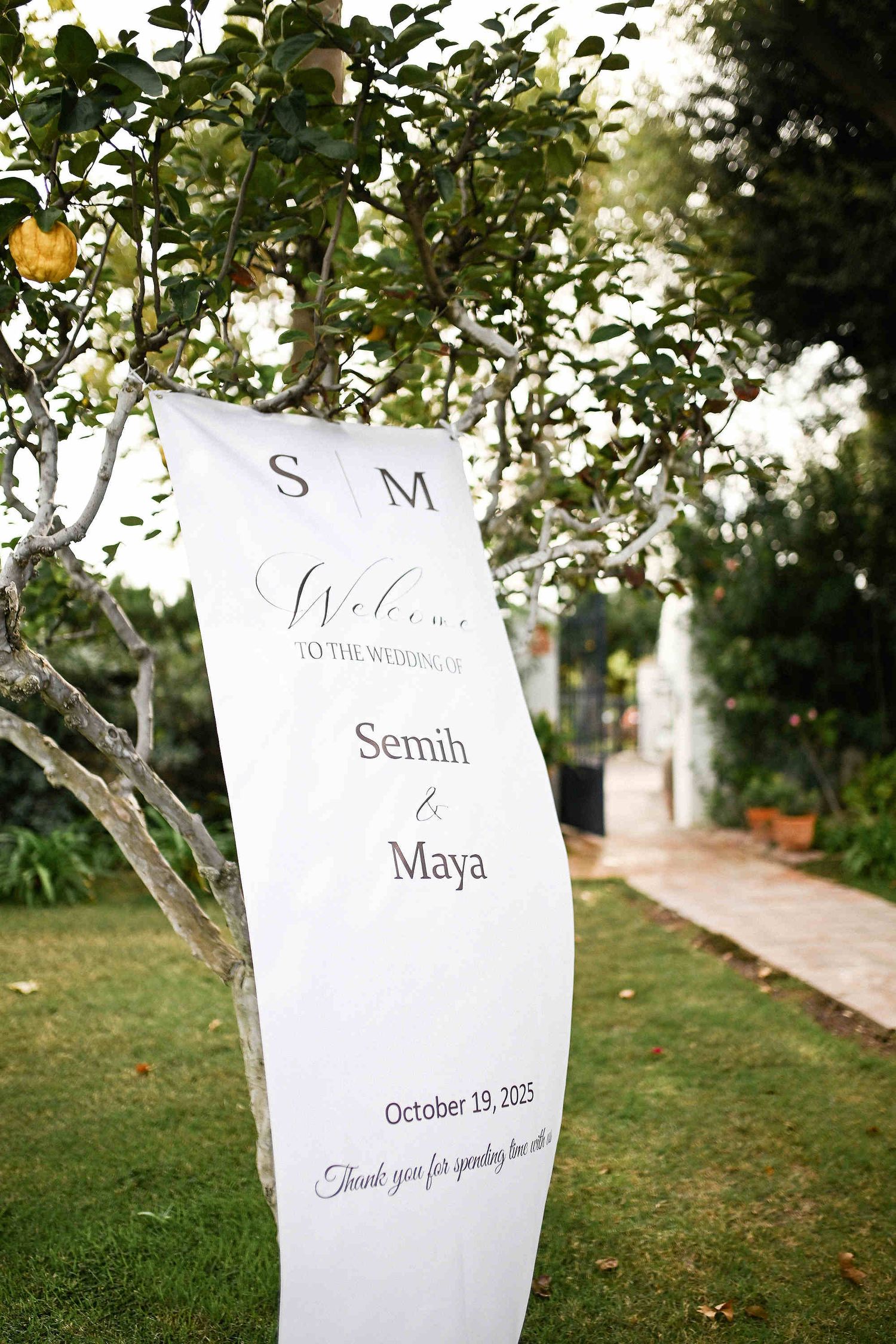 A personalized personalized wedding welcome banner with the couple's names blowing dynamically in the wind