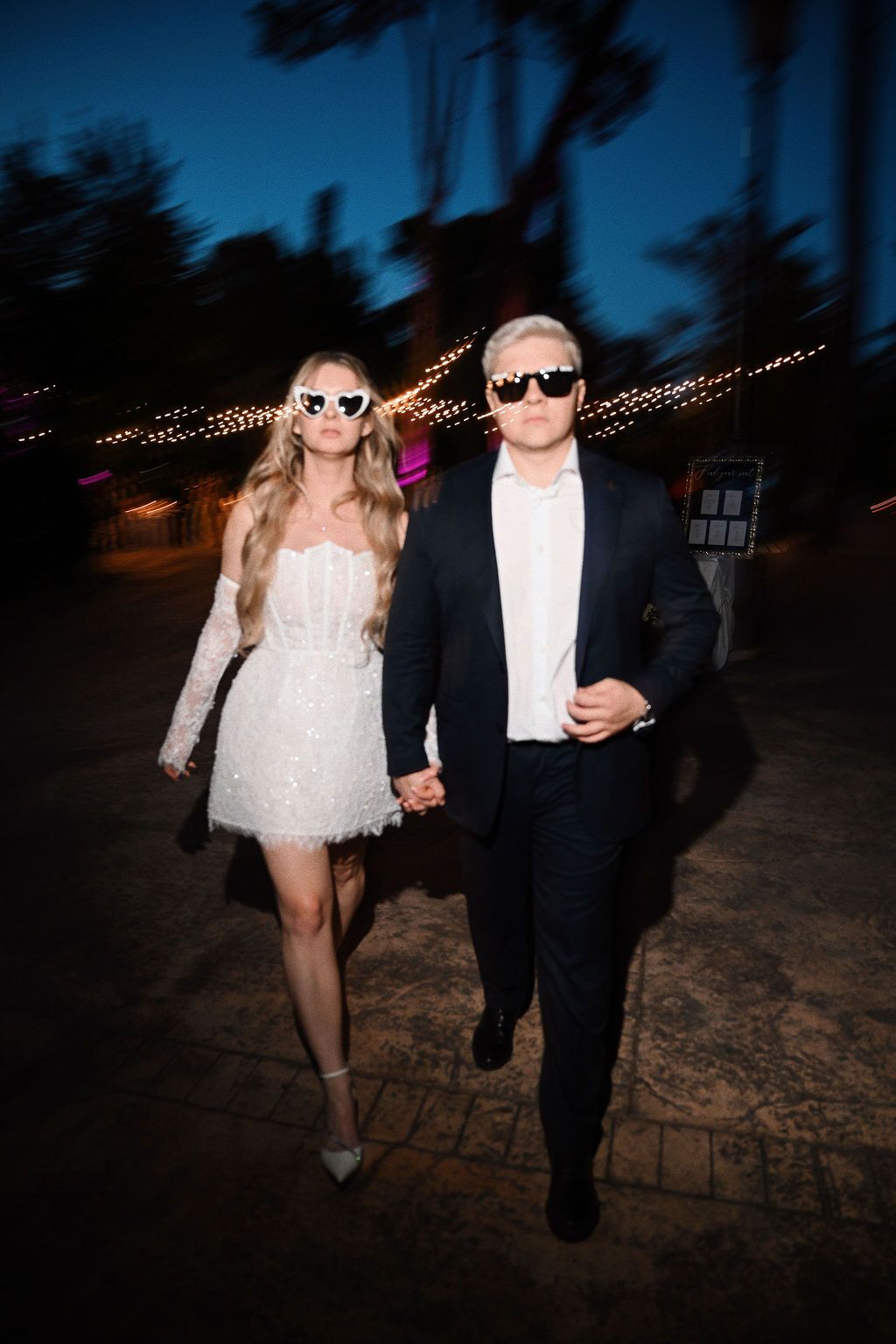 Motion blur photo of the bride in a short second dress and groom dancing at Finca El Senyoret. Dynamic Benidorm wedding night by Darista.