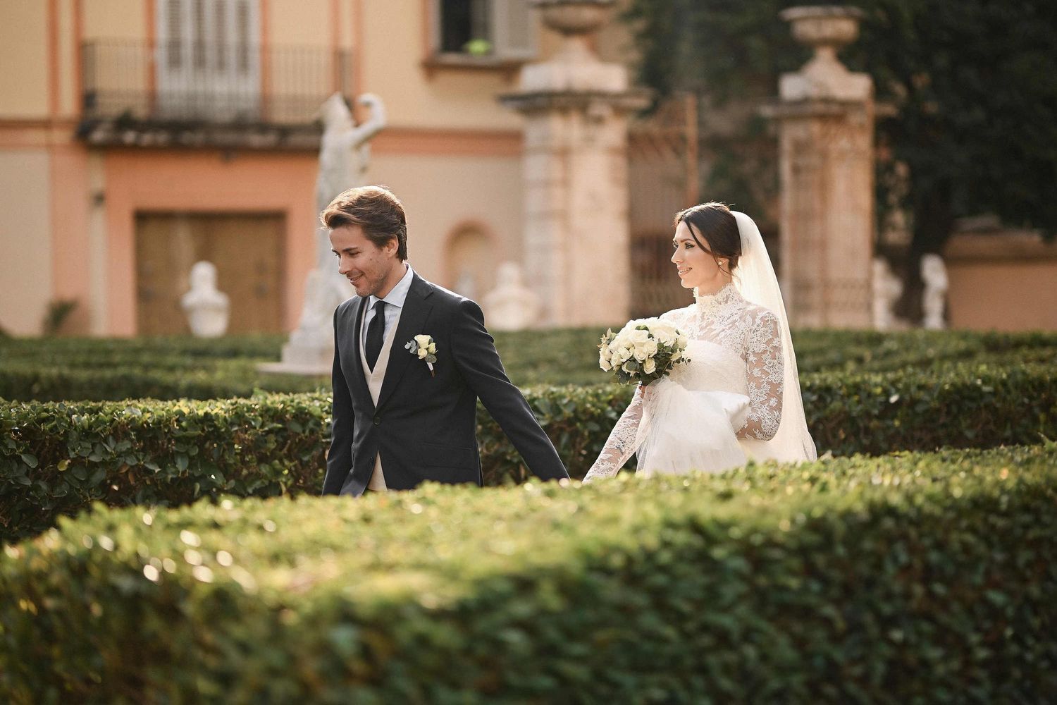 A soulful and heartfelt embrace as the groom holds his bride against the timeless backdrop of Valencia's historic architecture.