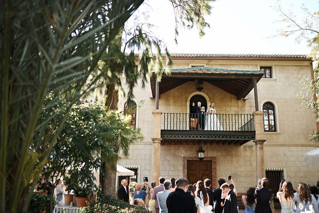 Wedding couple posing on the historic villa balcony at Finca El Senyoret. Fine art wedding photography in Benidorm, Spain.