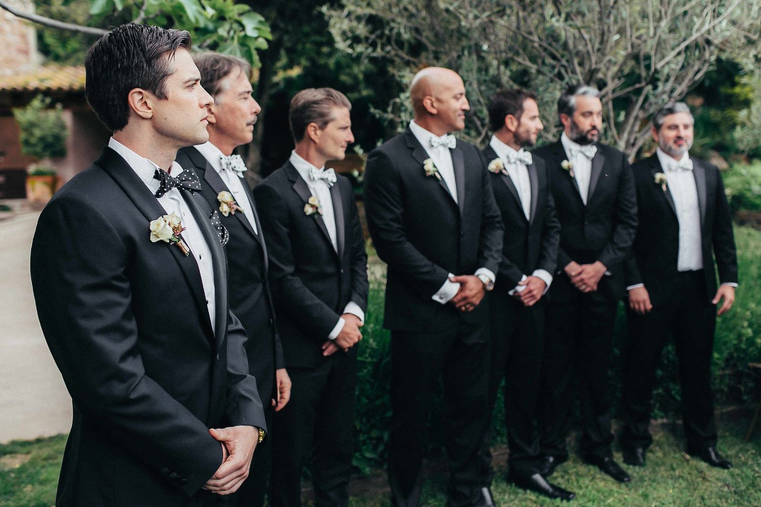 The groom and his friends watching the bride's entrance. A raw, emotional documentary shot during a destination wedding in Catalonia
