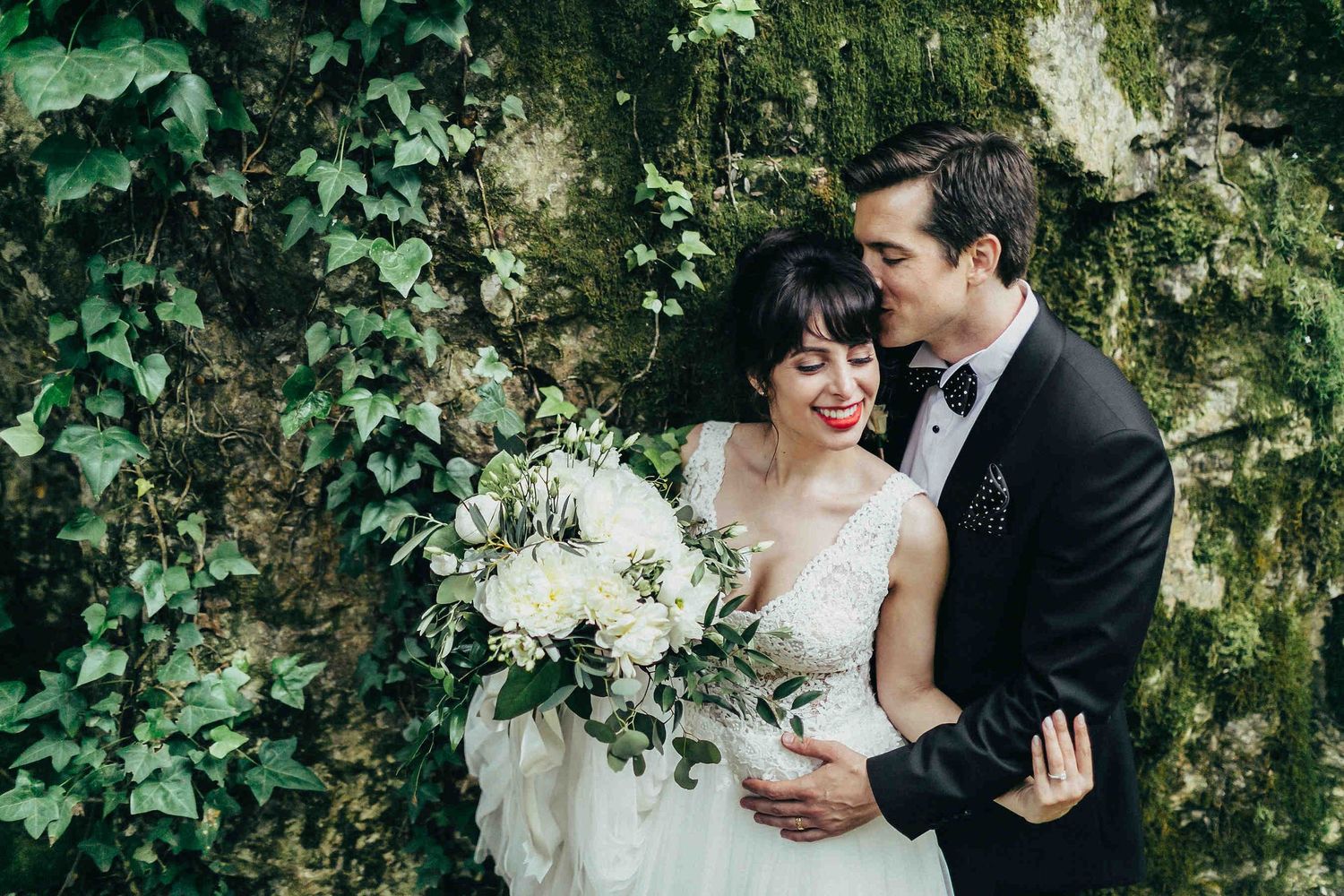 Editorial wedding portrait of the couple against a backdrop of majestic cliffs. Captured during a private photo session in the Barcelona reg