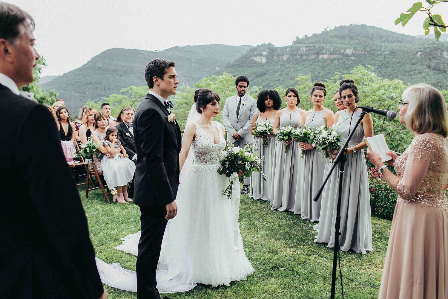 Scenic outdoor ceremony with guests against the breathtaking mountain landscape of Catalonia mountains