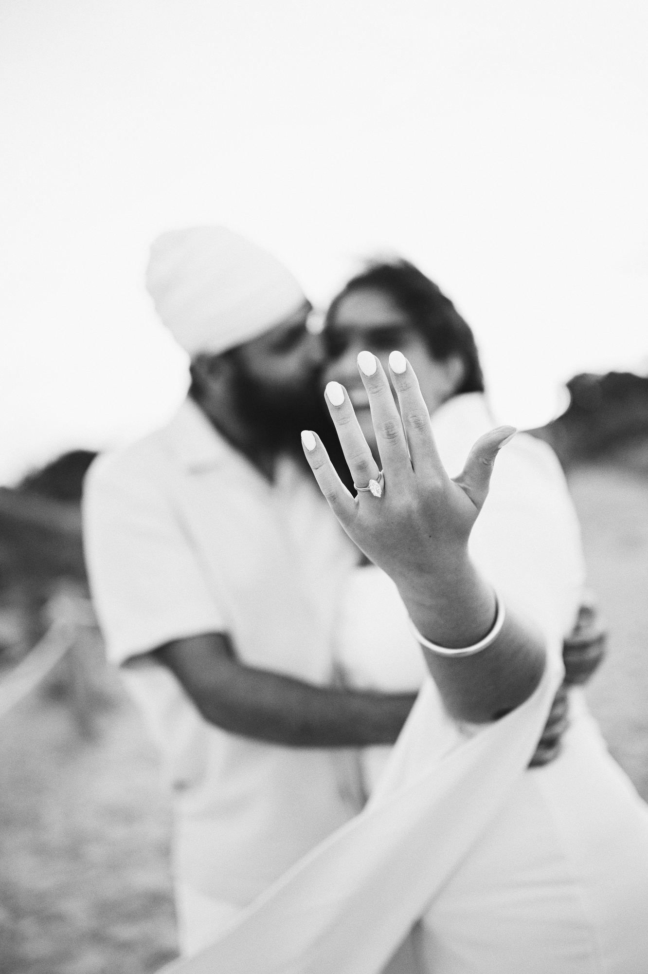 Happy woman showing her new ring to the camera after a successful surprise marriage proposal - professional photo and video in valencia
