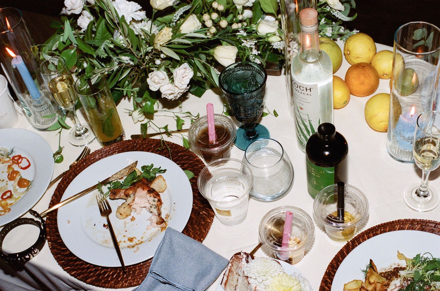 Elegant wedding reception table settings with wine glasses, floral centerpieces and place settings.