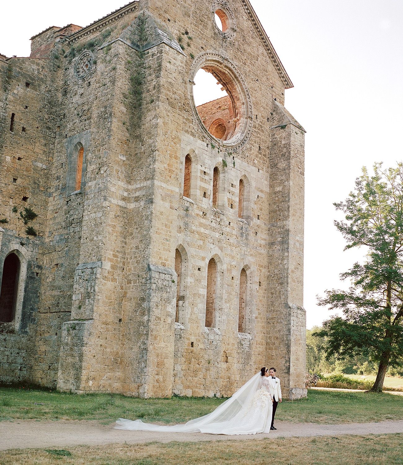 Ancient stone church facade with arched windows and weathered architectural details.