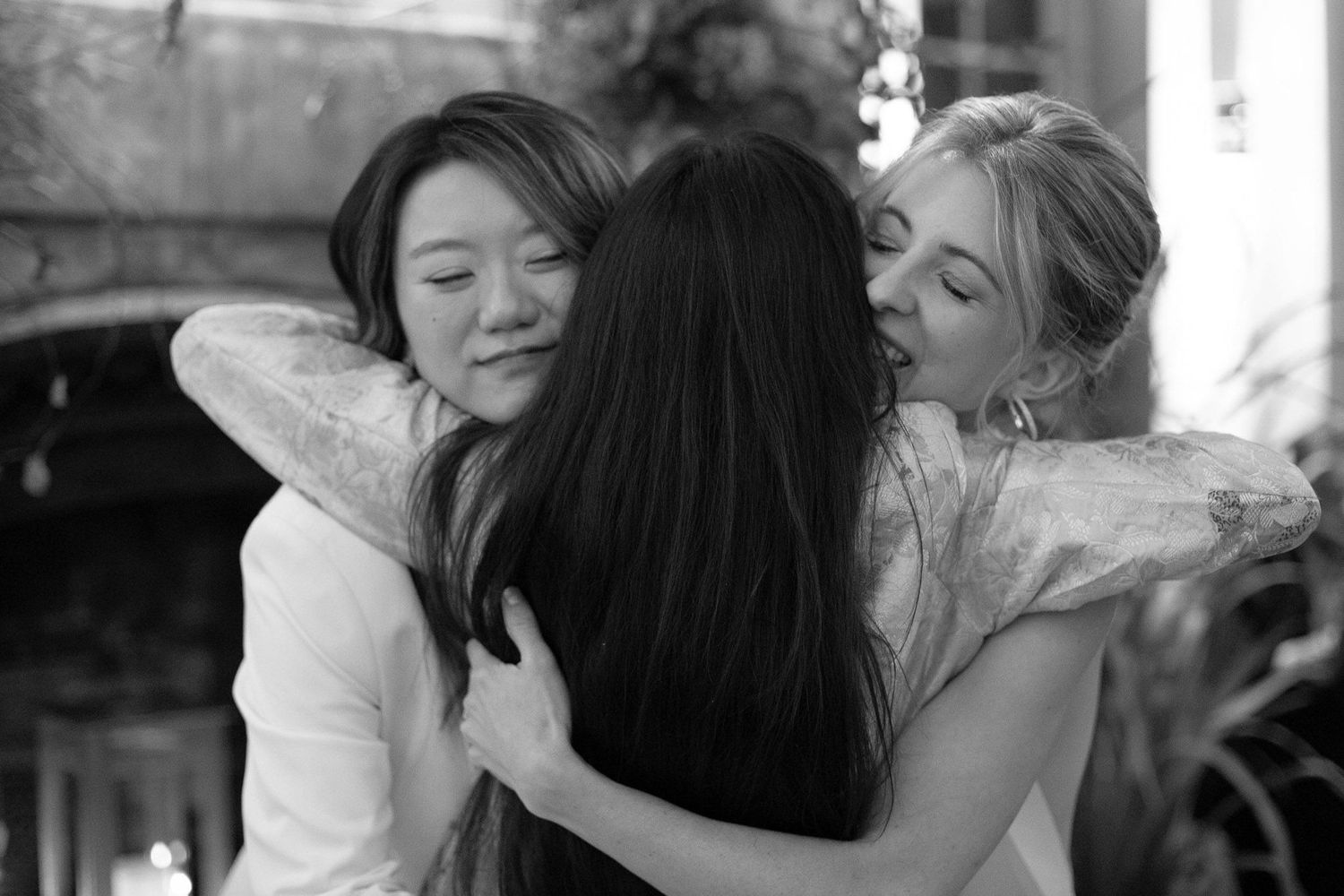 Black and white candid shots of emotional moments during a wedding celebration.