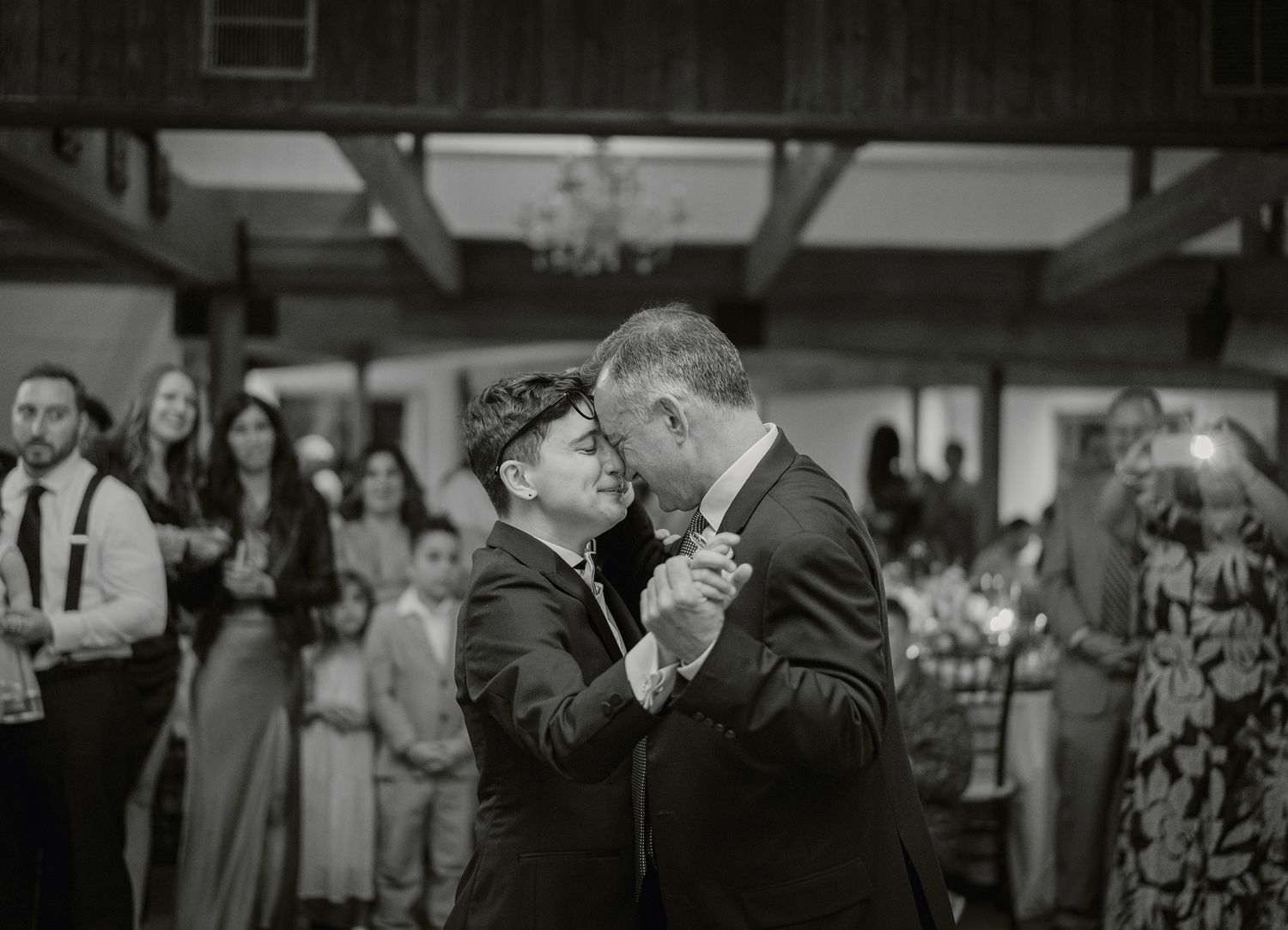 Black and white photos of emotional moments during wedding speeches.