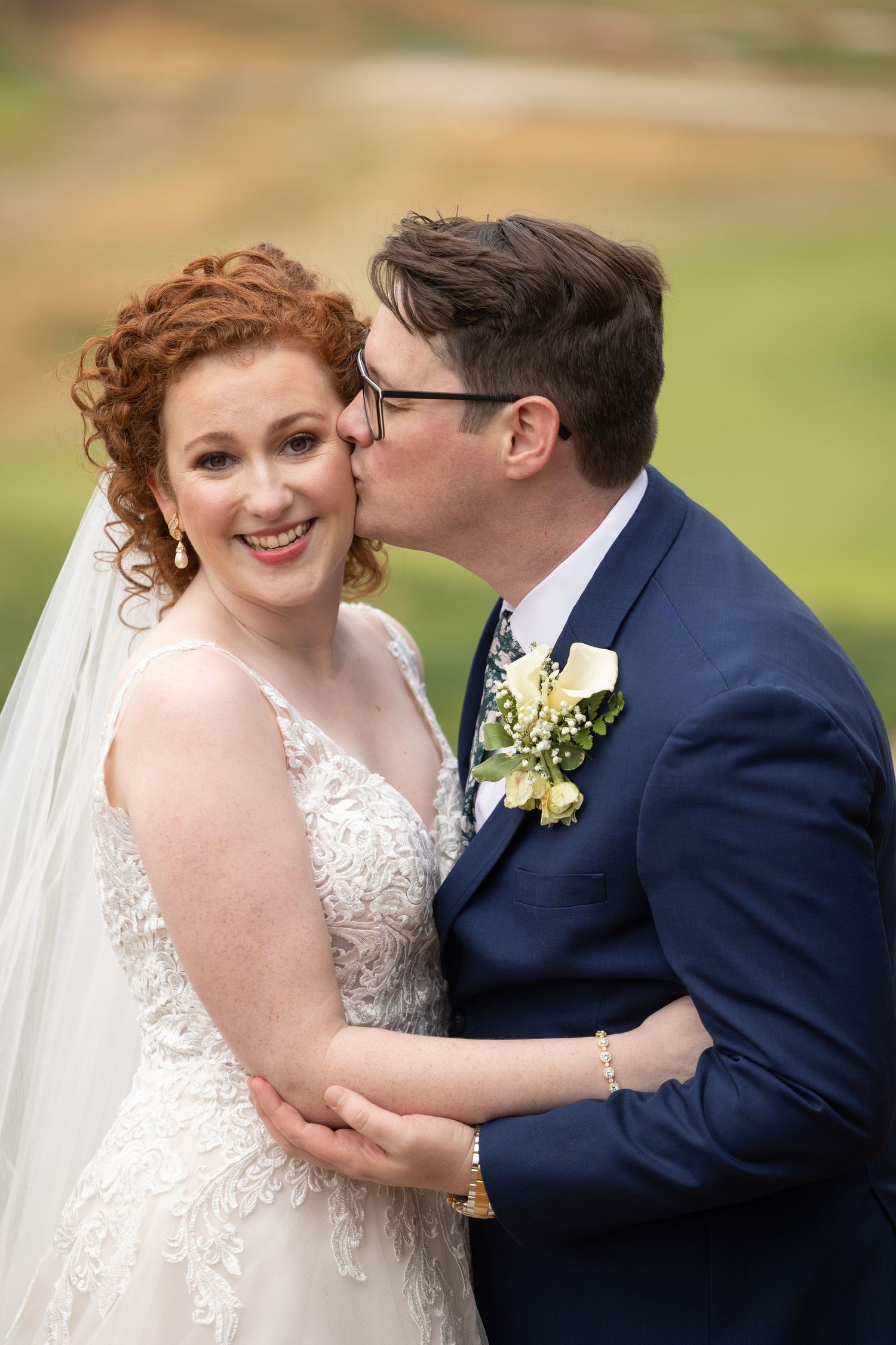 An intimate wedding portrait showing a loving embrace.