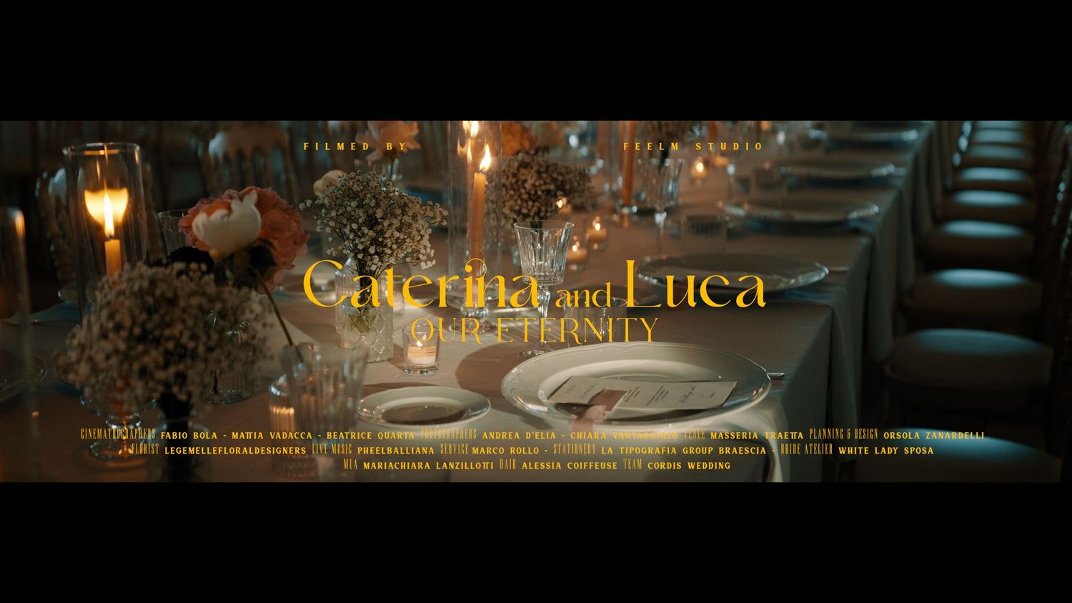 A romantic restaurant table setting with glowing candlelight and wine glasses for Giorgios and Luca.