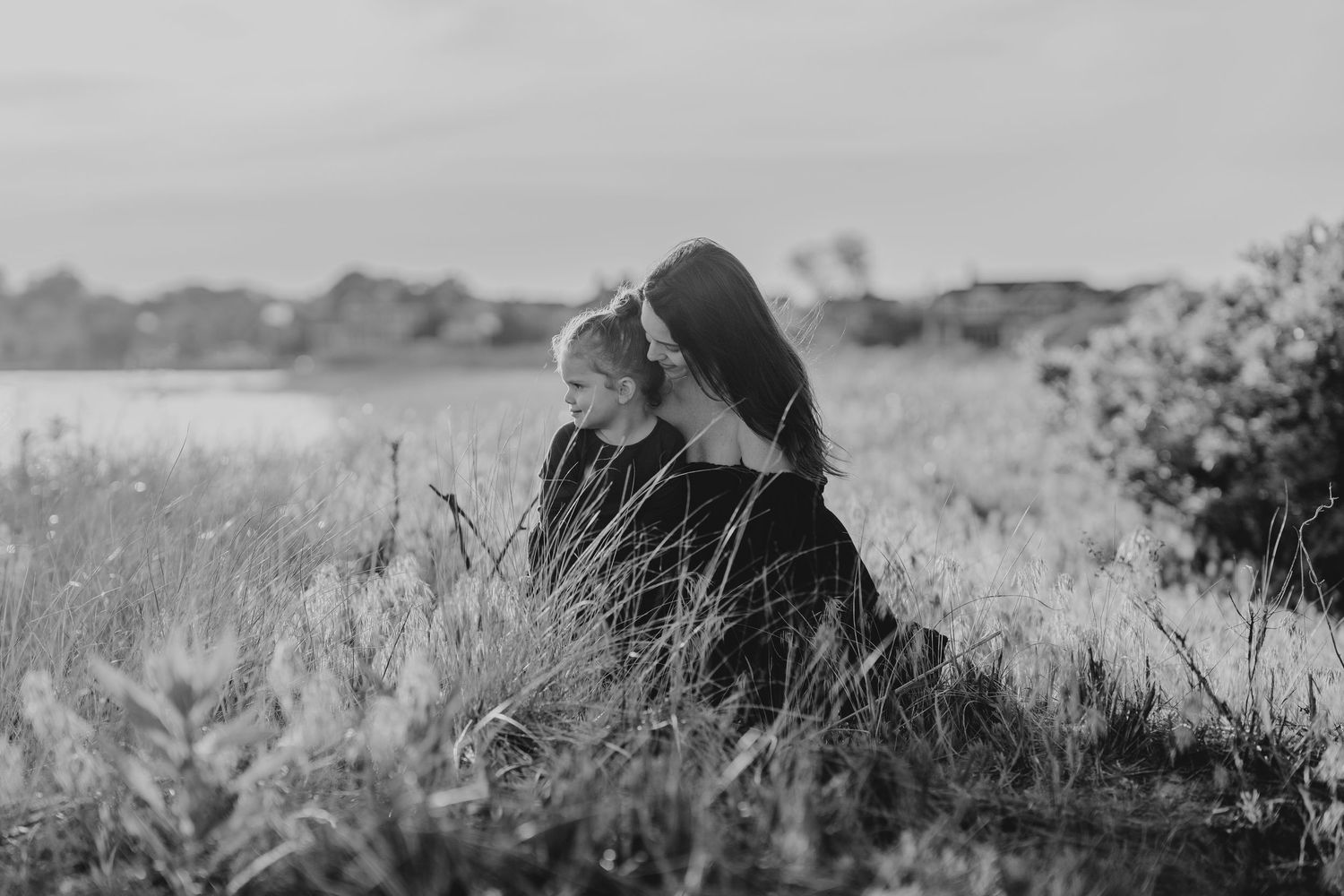 Scenic black and white landscape with tall grass and natural elements.