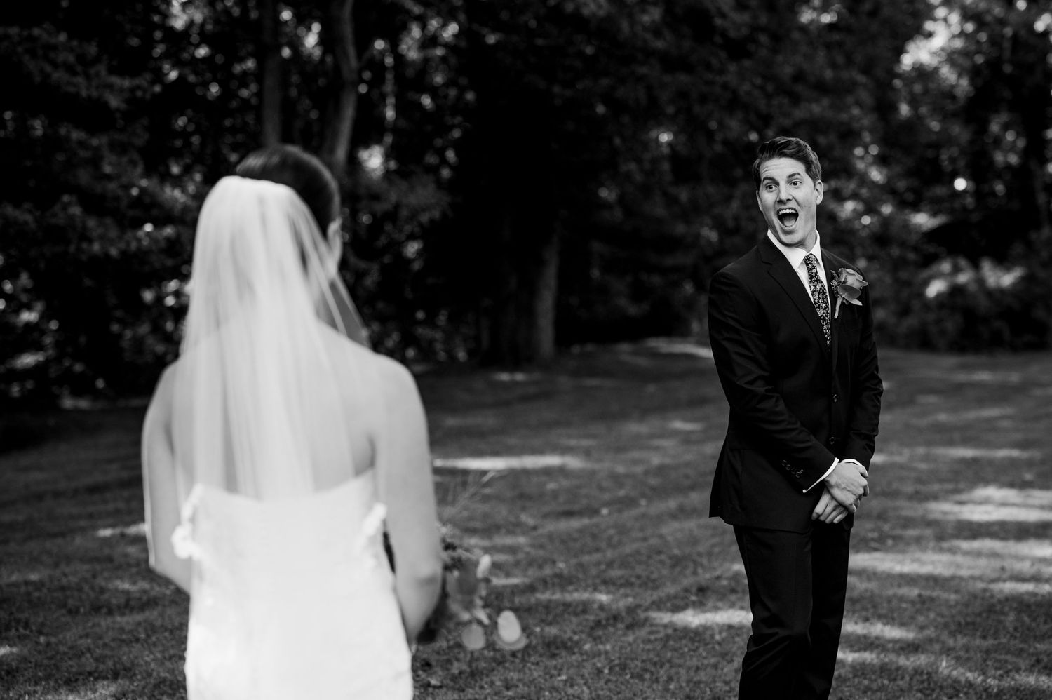 Black and white series showing first look reactions between couple on wedding day.