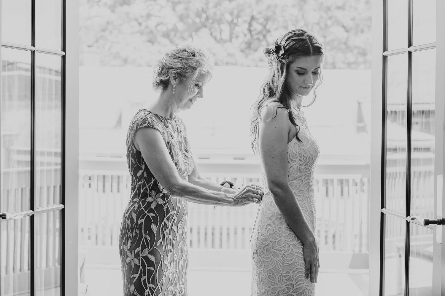 Elegant wedding preparation moments captured in bright natural window light.