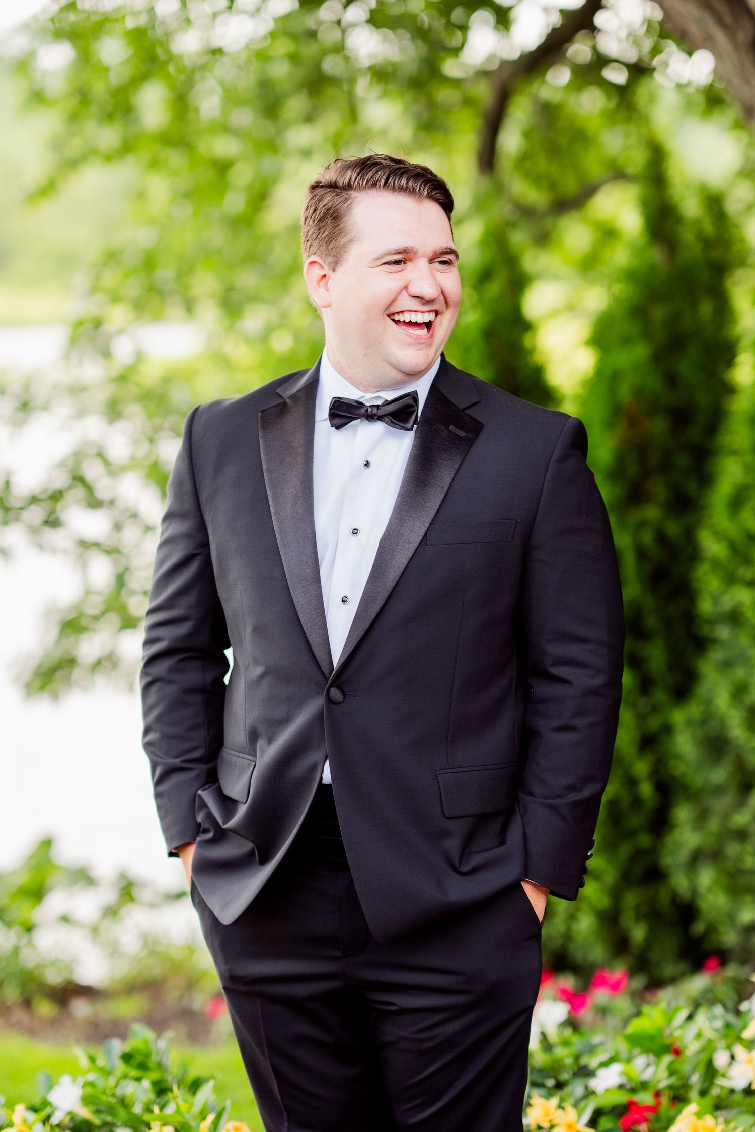 Formal portraits in a lush garden setting with blooming flowers.