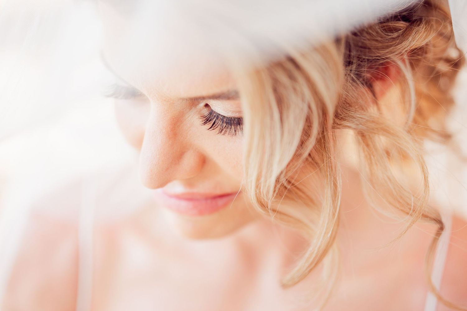 Ethereal high-key beauty portrait details in soft lighting.