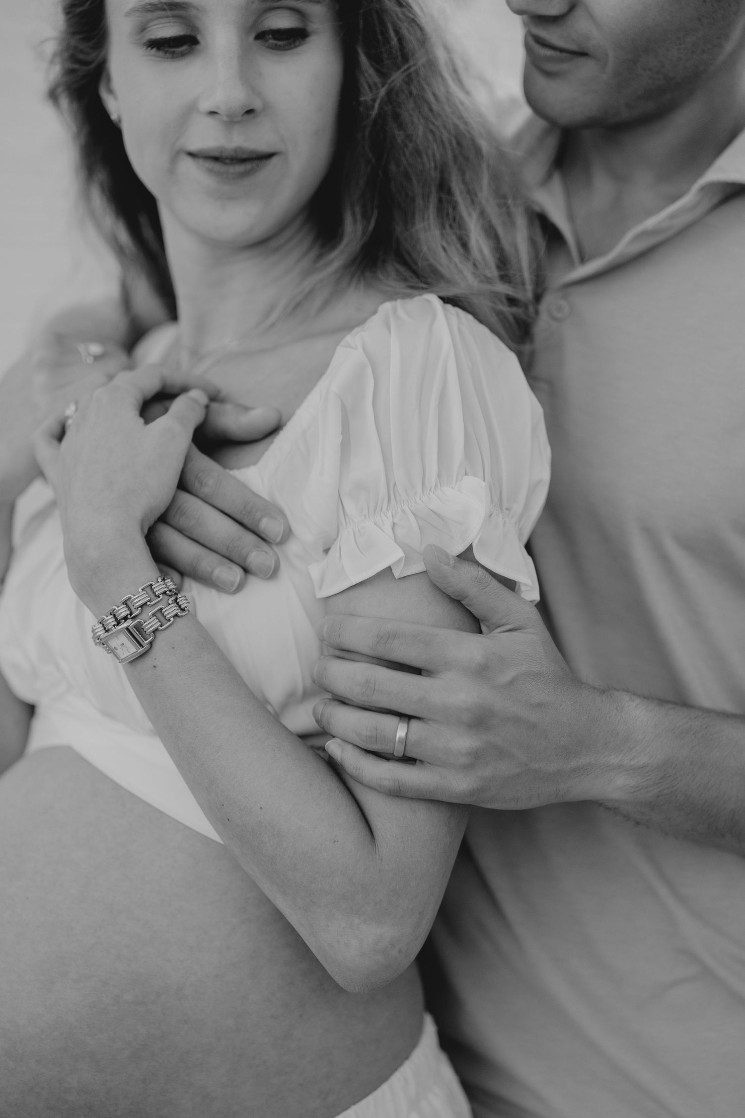 Close-up black and white intimate portrait showing tender embrace.