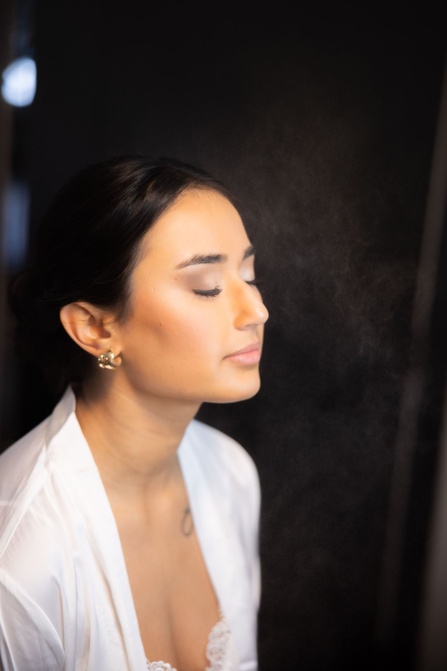 Close-up beauty portraits showing elegant bridal makeup and styling against dark background.