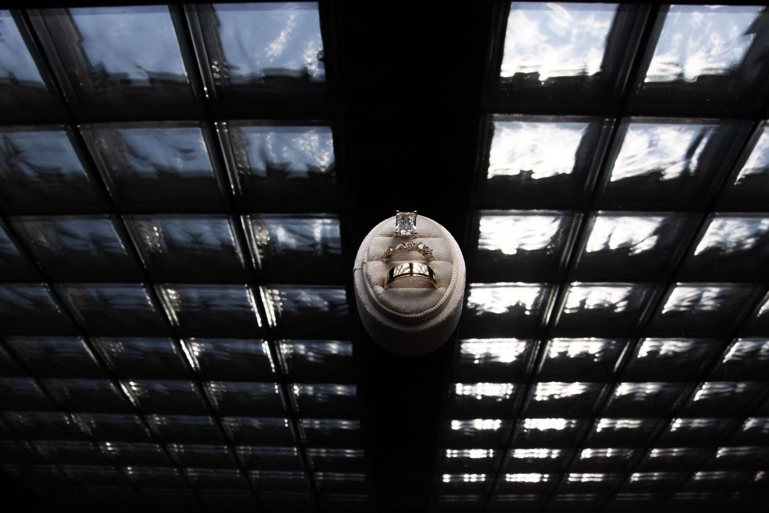 Architectural detail of industrial-style skylight windows creating dramatic lighting patterns.