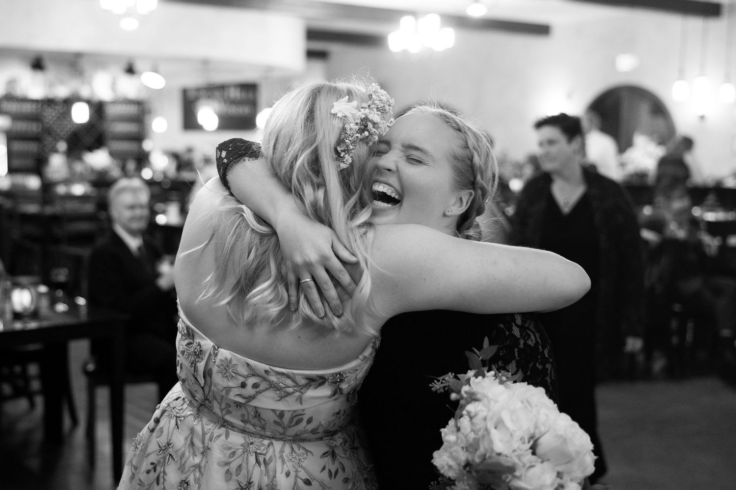 Wedding reception dance floor filled with guests enjoying a lively celebration.
