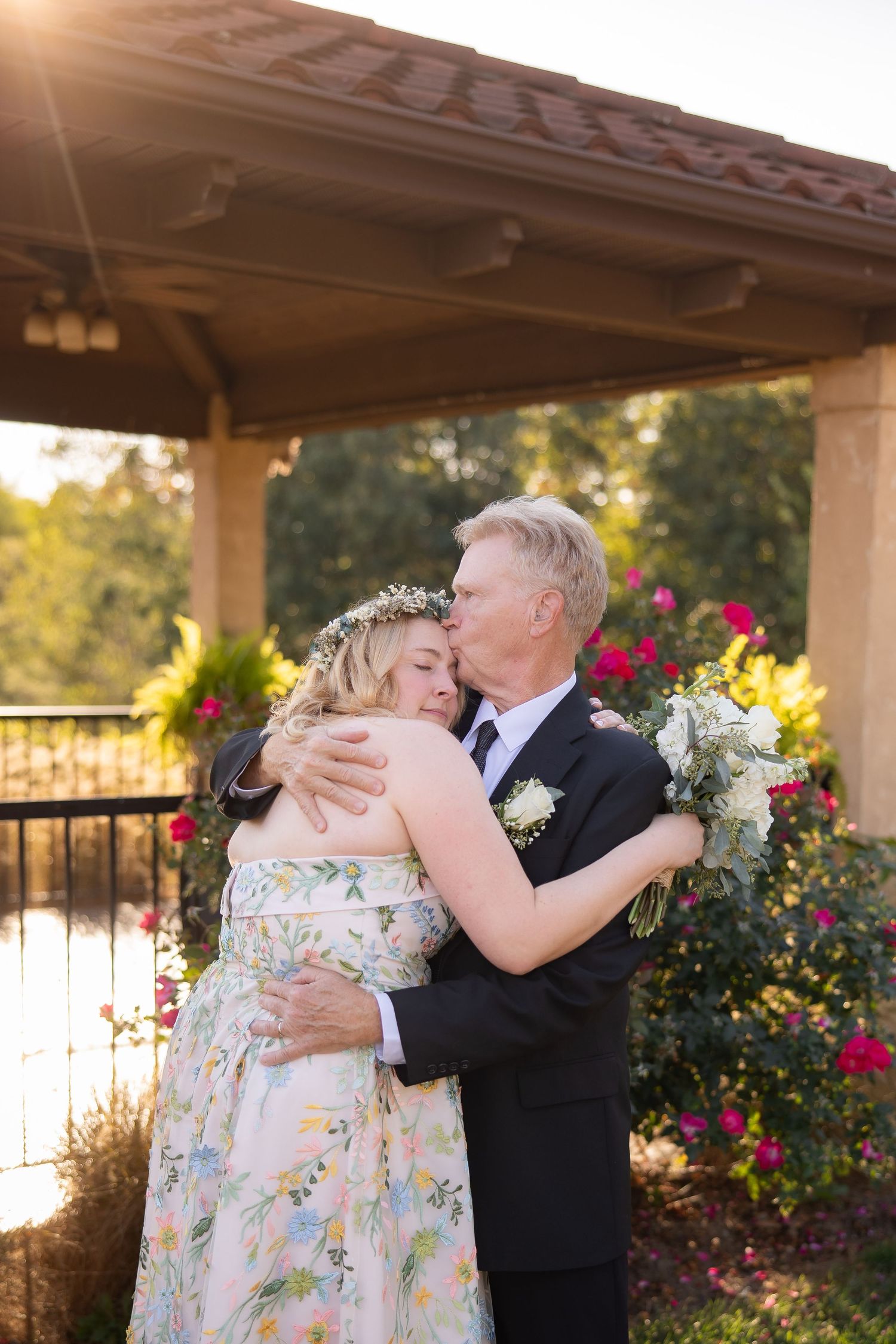 A romantic sequence of wedding photos showing a couple embracing under a covered porch with blooming flowers in the background.