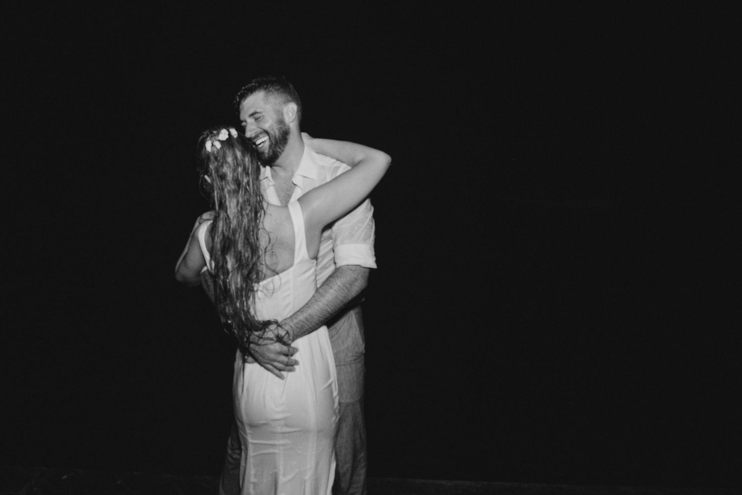 Romantic black and white dance sequence showing intimate moments at a wedding celebration.