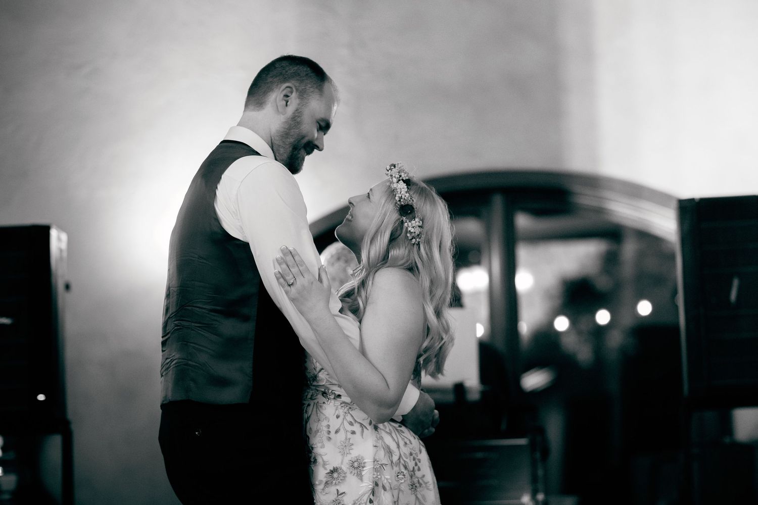 A black and white photo captures an intimate dance moment between a couple.