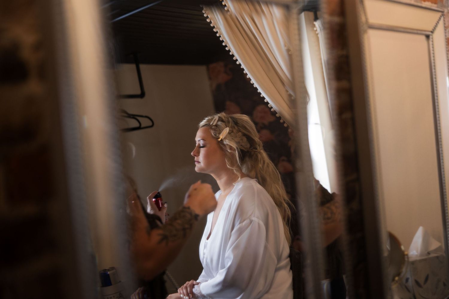A series of wedding photographs showing a bride in a white dress getting ready with bridesmaids in a sunlit room.